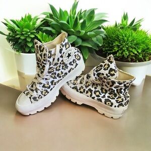Converse leopard print Chuck Taylor All Star lugged platform high tops.